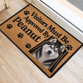 Husky door mat featuring a realistic dog portrait and paw prints beside an interior door