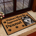 Husky doormat staged near a glass entry door with wood flooring and a home entrance