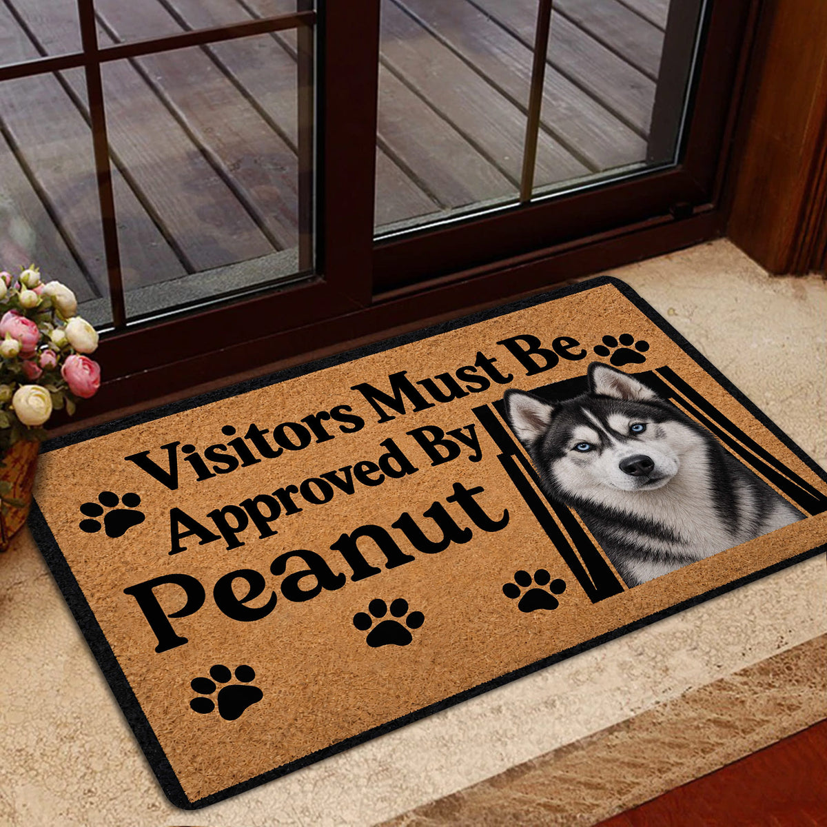 Husky doormat staged near a glass entry door with wood flooring and a home entrance