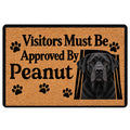 Labrador Retriever doormat with paw prints, black dog portrait, and playful entryway message