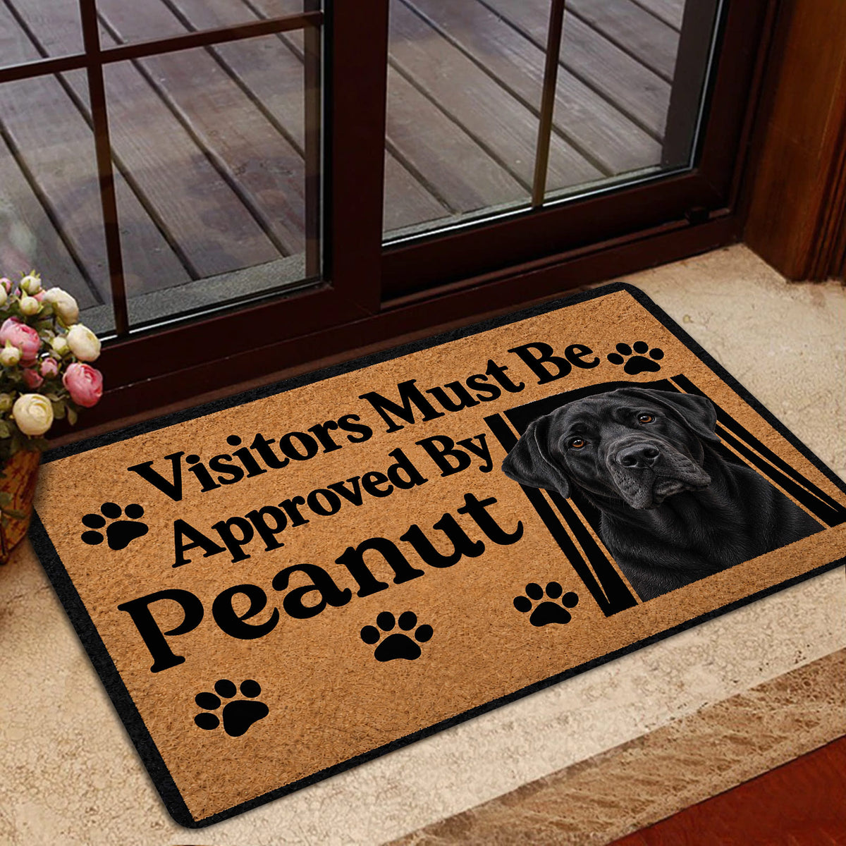 Labrador Retriever door mat styled by a glass doorway with a black dog portrait and paw prints