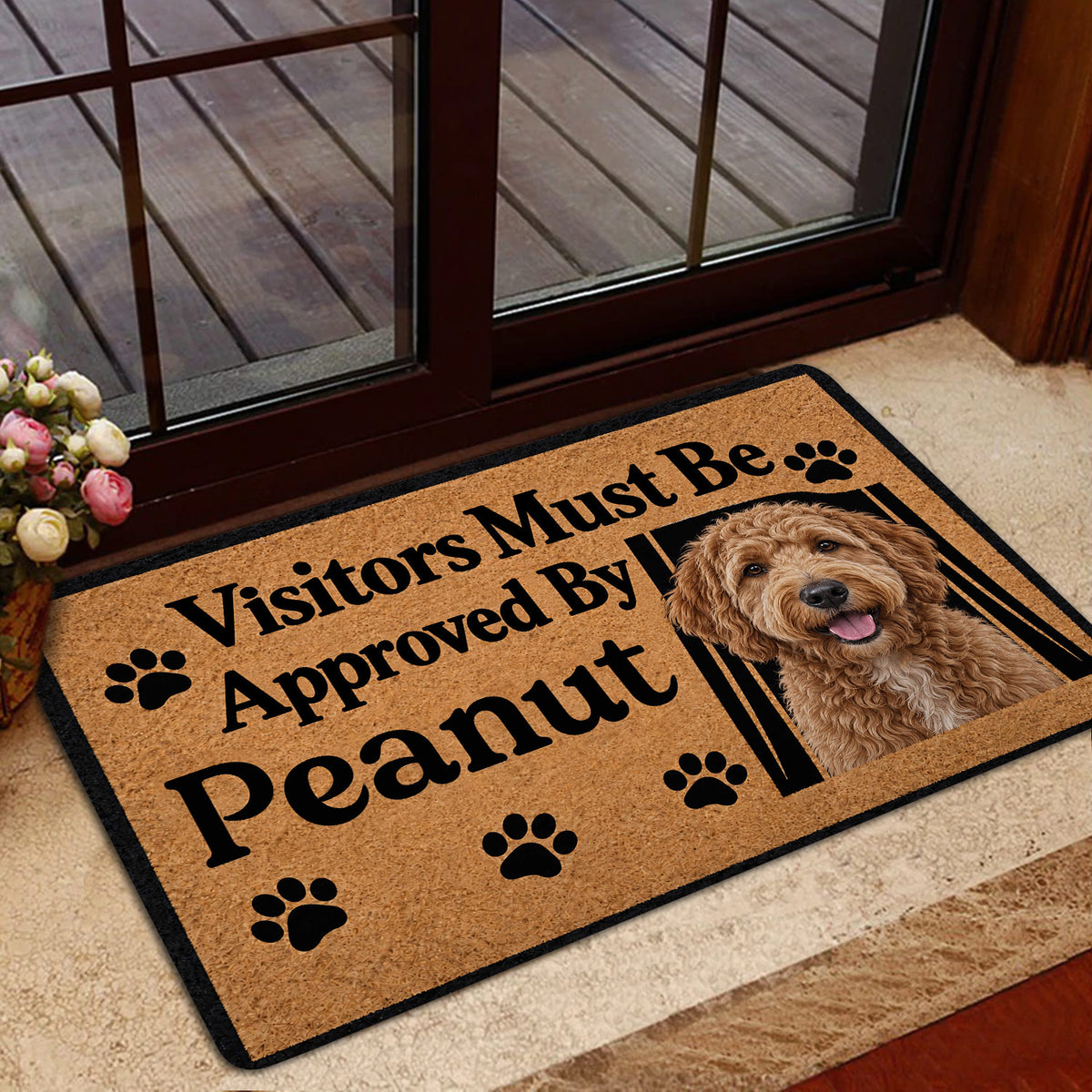 Goldendoodle doormat styled by a glass entry door with a cheerful dog portrait and tan paw print design
