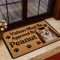 Corgi door mat shown in a home entrance beside glass doors, with tan artwork and black border