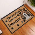Beagle entryway doormat displayed on a hardwood floor beside a front door