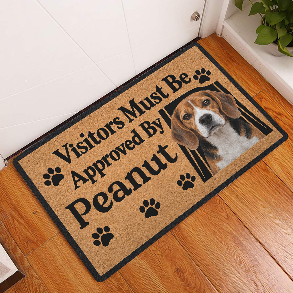 Beagle entryway doormat displayed on a hardwood floor beside a front door