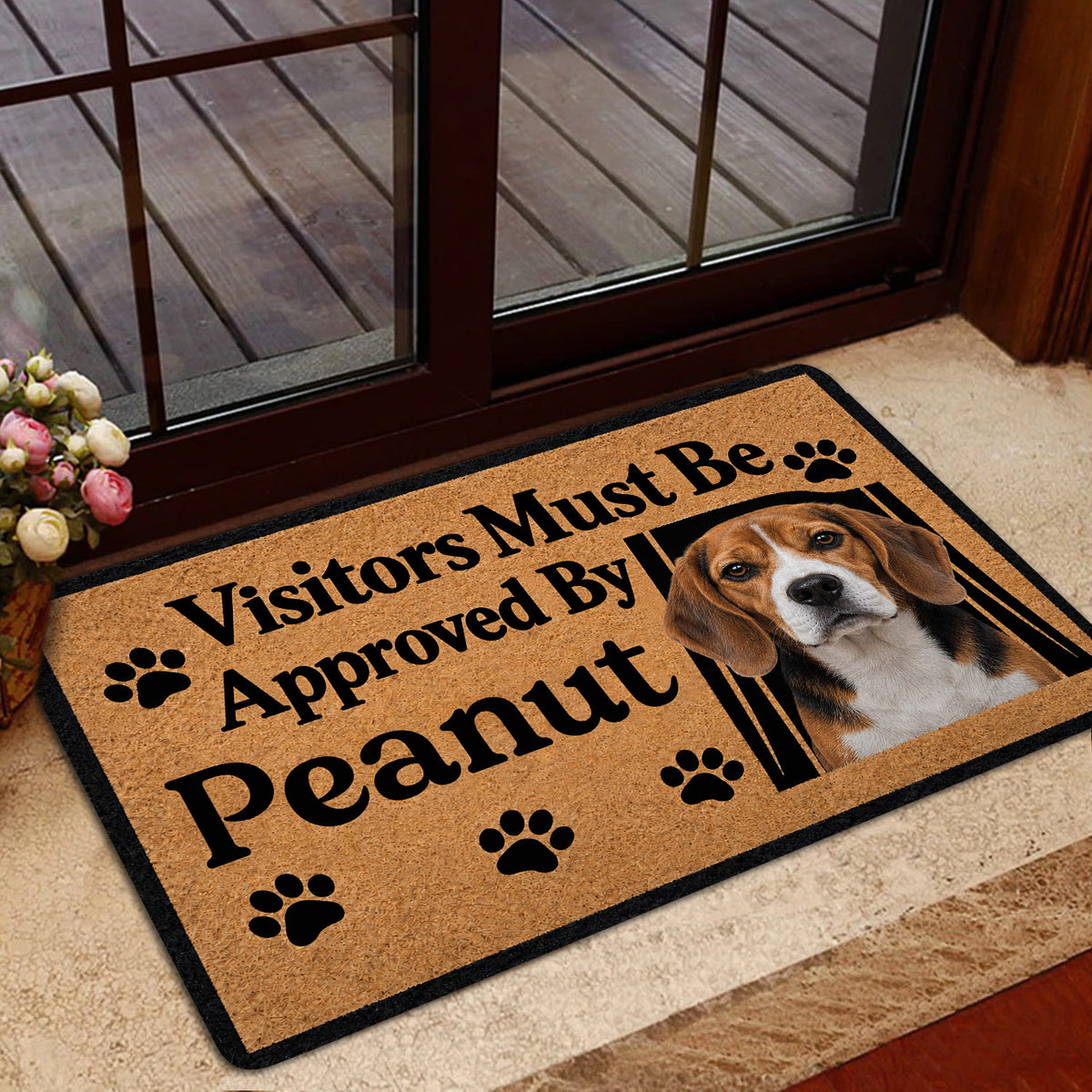 Beagle door mat displayed near a glass entry door with a warm dog-lover design