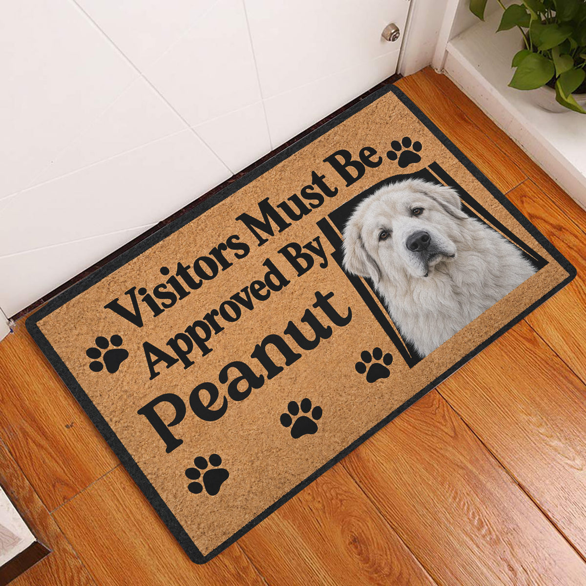 Great Pyrenees entryway rug displayed by a front door on hardwood flooring