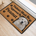 Great Pyrenees door mat positioned at an indoor entrance with paw print artwork and bold lettering