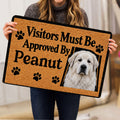 Person holding a Great Pyrenees doormat featuring a white dog portrait and black paw prints
