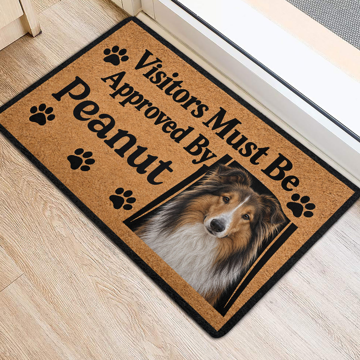 Rough Collie door mat positioned at a bright entryway with paw print accents