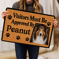 Person holding a Rough Collie doormat featuring a portrait, paw prints, and welcome artwork