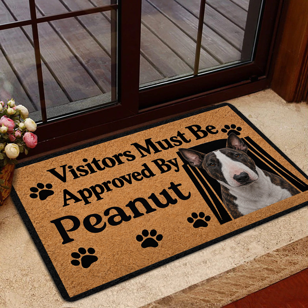 Bull Terrier doormat styled inside a glass doorway with tan artwork, black lettering, and paw prints