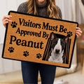 Person holding a Bull Terrier doormat featuring a realistic dog portrait and bold paw print design