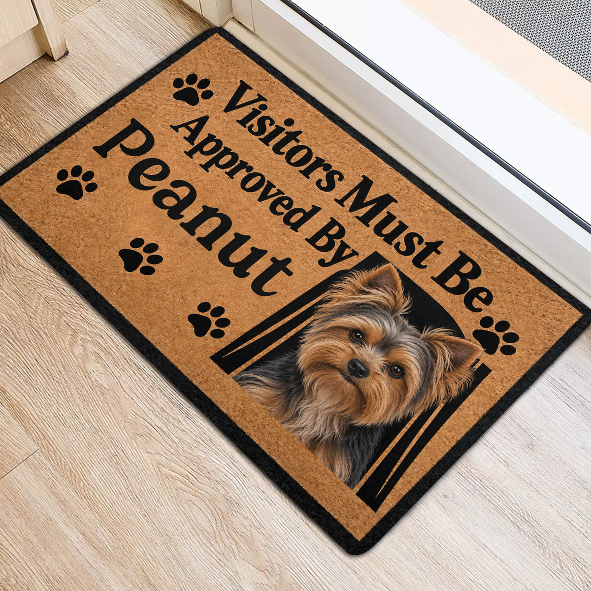 Yorkshire Terrier doormat styled at an indoor doorway with tan artwork and black paw prints