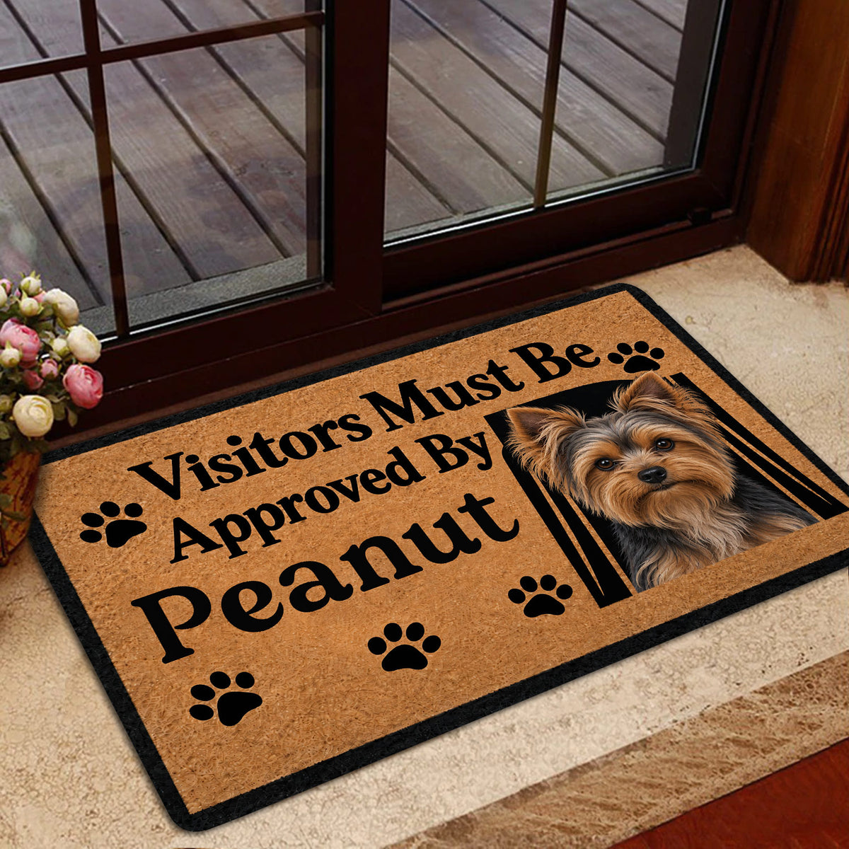 Yorkie welcome doormat presented near a glass entry door with a warm tan and black design