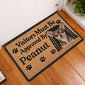 Chihuahua visitor message doormat displayed in a wood-floor entryway