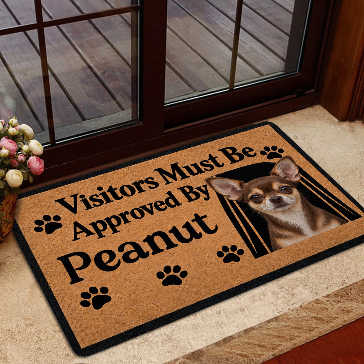 Chihuahua doormat shown in a home entrance beside glass doors and a deck