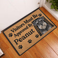 Miniature Schnauzer doormat displayed by a front door on a warm wood floor