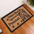 English Cocker Spaniel welcome doormat styled by a white door on a wood floor