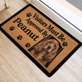 Cocker Spaniel portrait doormat placed at an indoor entrance with paw print details