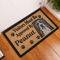 American Staffordshire dog doormat displayed in a home entryway on a warm wood floor