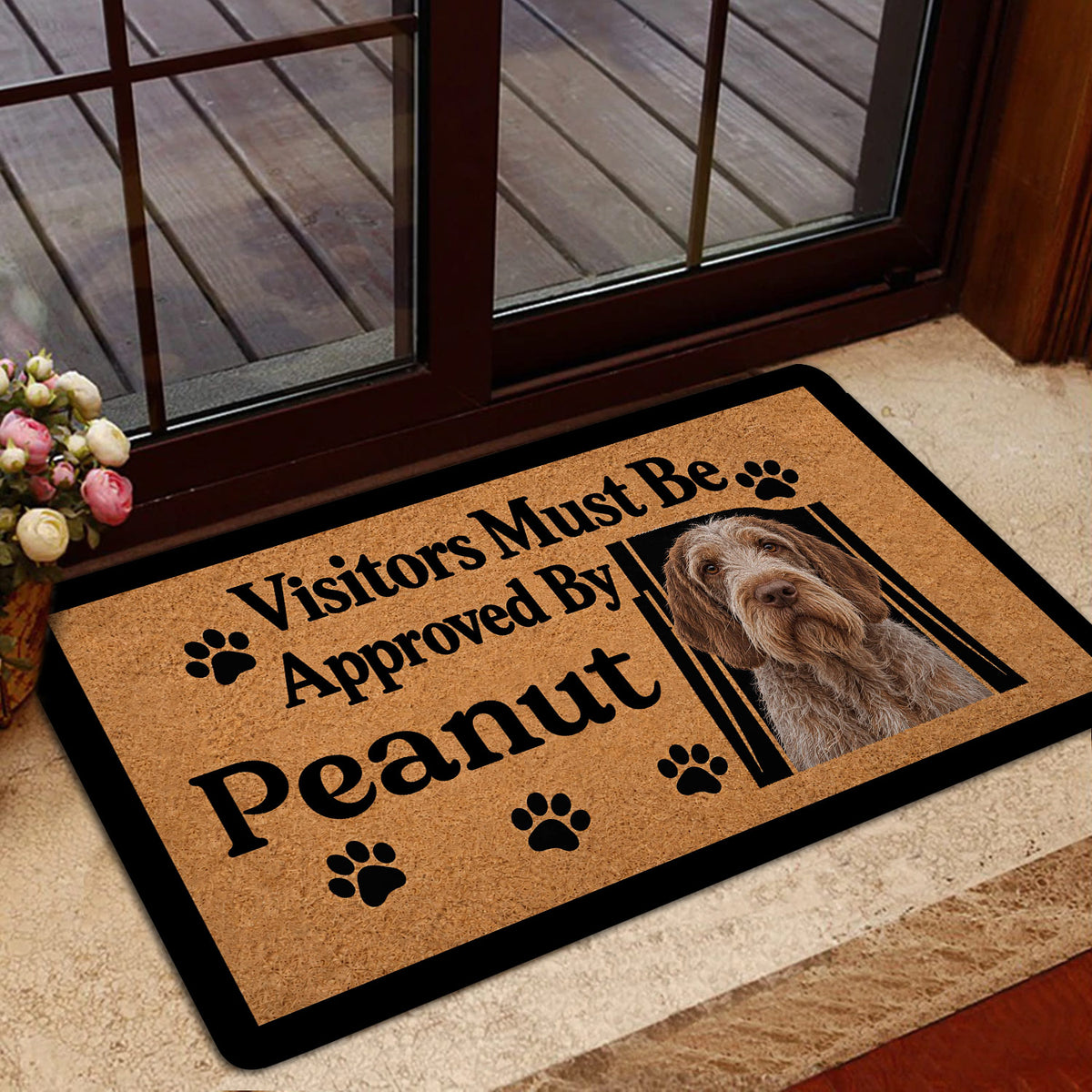Dog-themed Spinone Italiano doormat styled at a glass entry door
