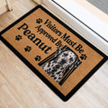 Spotted Dalmatian dog doormat positioned at an indoor entrance with paw print accents