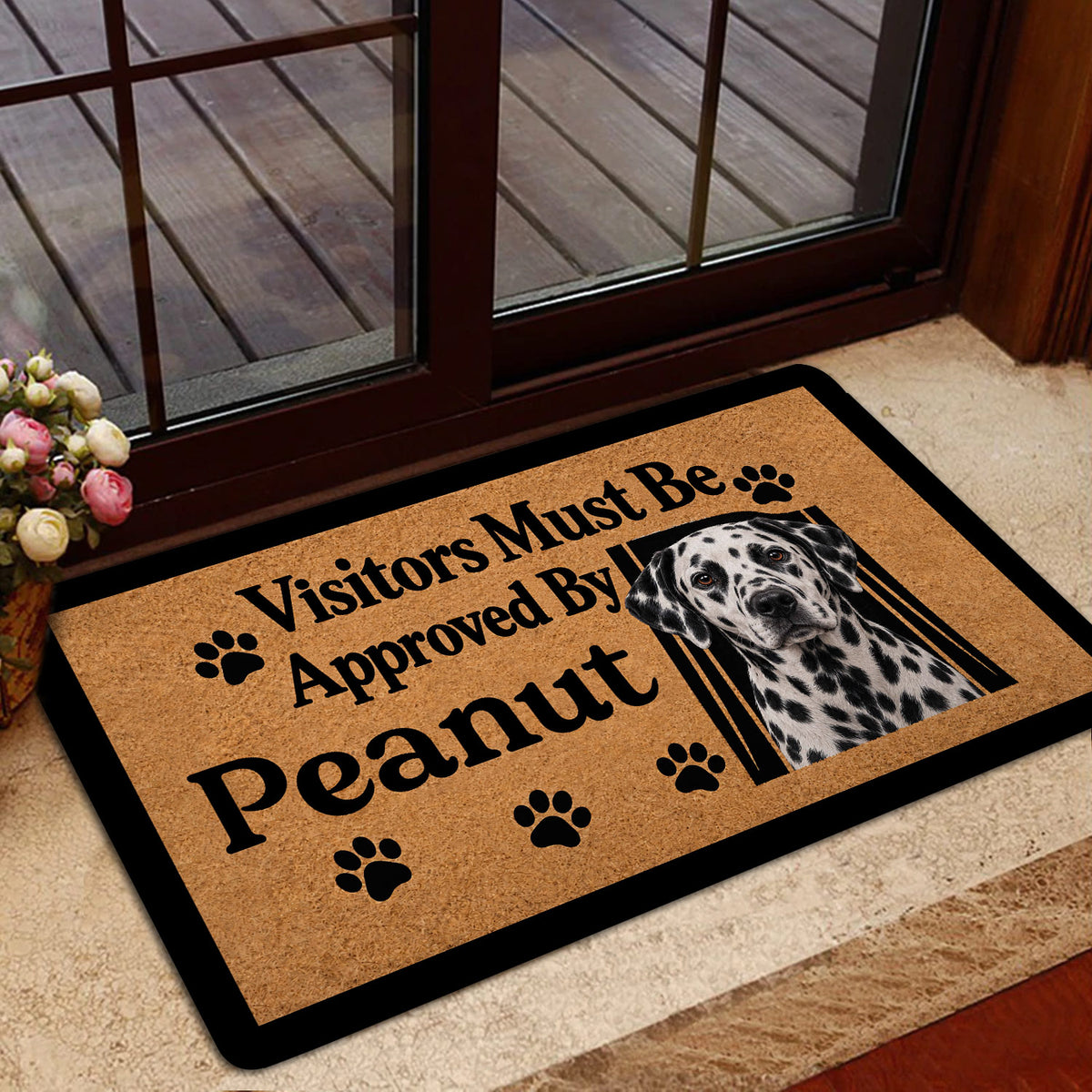 Dalmatian welcome doormat shown inside a home near a glass door and entryway