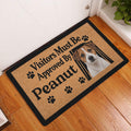 Jack Russell dog doormat displayed in a home entryway on a warm wood floor