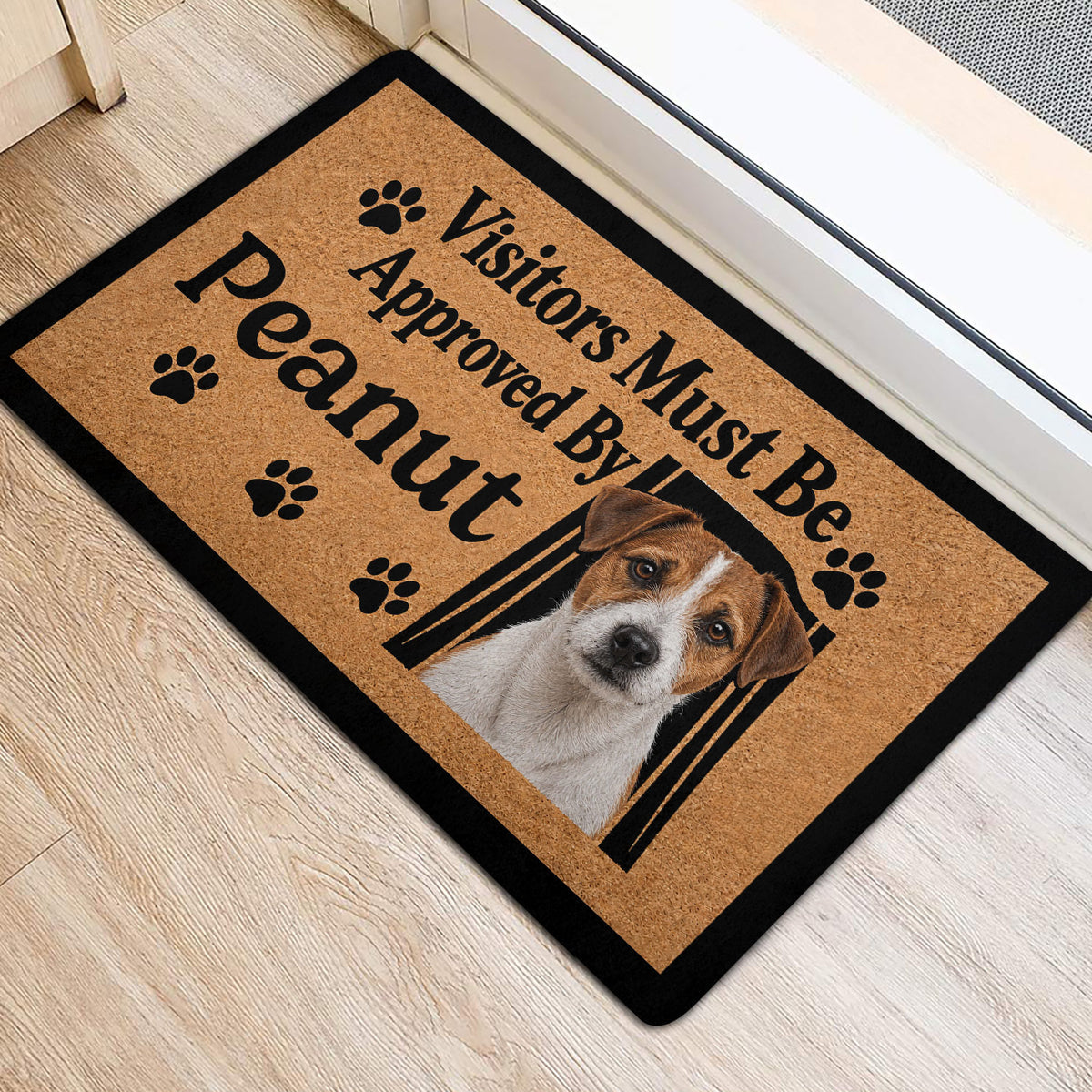 Jack Russell entryway rug positioned beside a door with terrier artwork and paw print accents