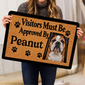 English Bulldog doormat held indoors, showing the full brown paw print design and black border