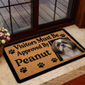 Shih Tzu welcome doormat styled inside a glass doorway with a wood deck visible outside