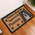 Boston Terrier welcome doormat displayed at a home entrance on a warm wood floor