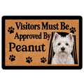 Westie doormat with a white terrier portrait, paw prints, bold black lettering and a warm tan background