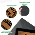 Close-up of Westie doormat surface and black rubber backing showing the mat's construction details