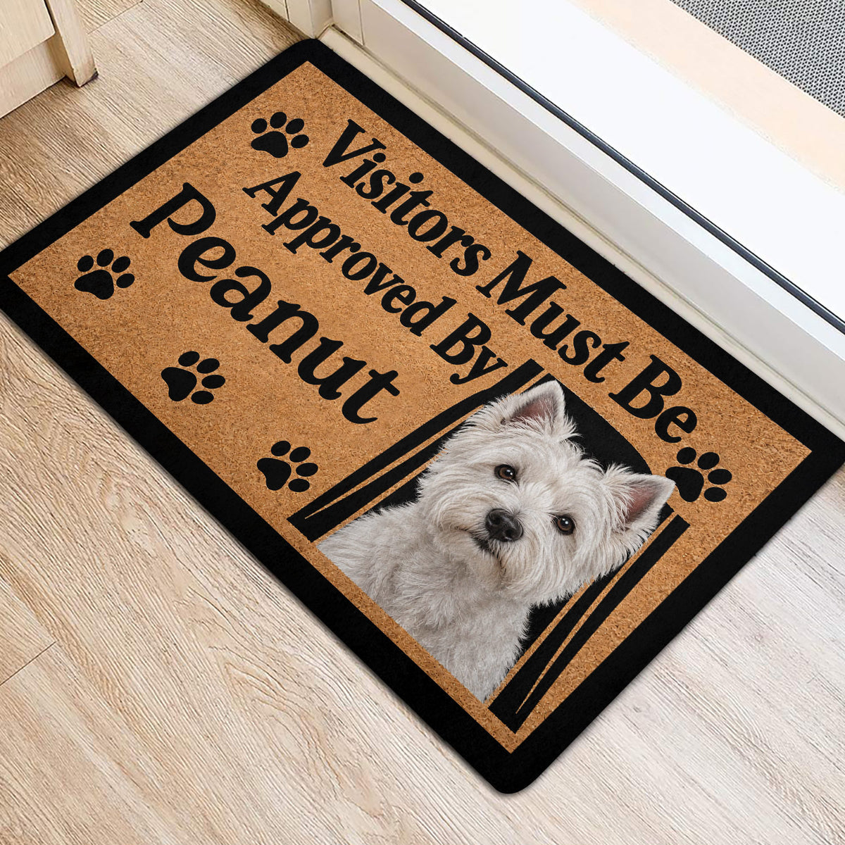 Westie entryway rug featuring a white terrier portrait, paw prints and welcoming black typography