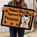 Westie doormat held indoors, showing the white terrier artwork, paw prints and tan textured background
