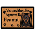 Miniature Pinscher doormat with black and tan dog portrait, paw prints and a welcoming entryway design