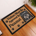 Miniature Schnauzer entryway doormat displayed on a wood floor beside a white door