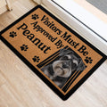 Miniature Schnauzer door mat shown at a home entrance with a tan paw print design and black border