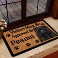 Poodle welcome mat shown at a home entrance with a glass door, flowers, and warm interior decor