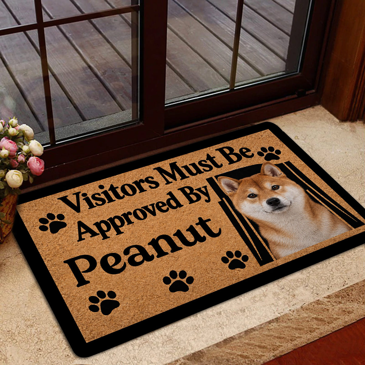 Shiba Inu doormat positioned at a home entrance beside a glass door