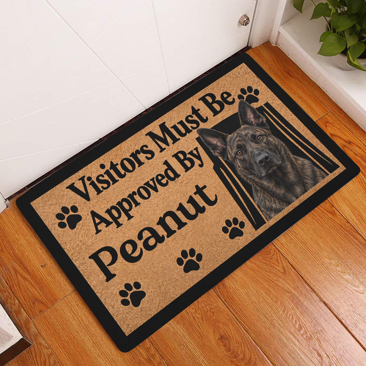 Dutch Shepherd doormat displayed in an indoor entryway beside a white door and wood floor