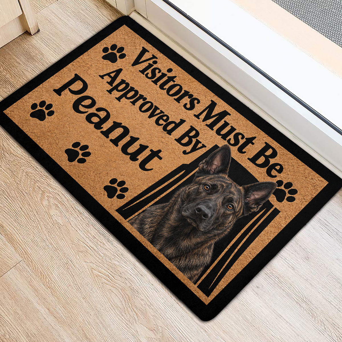 Dutch Shepherd entryway mat shown near a doorway with portrait artwork and paw-print accents