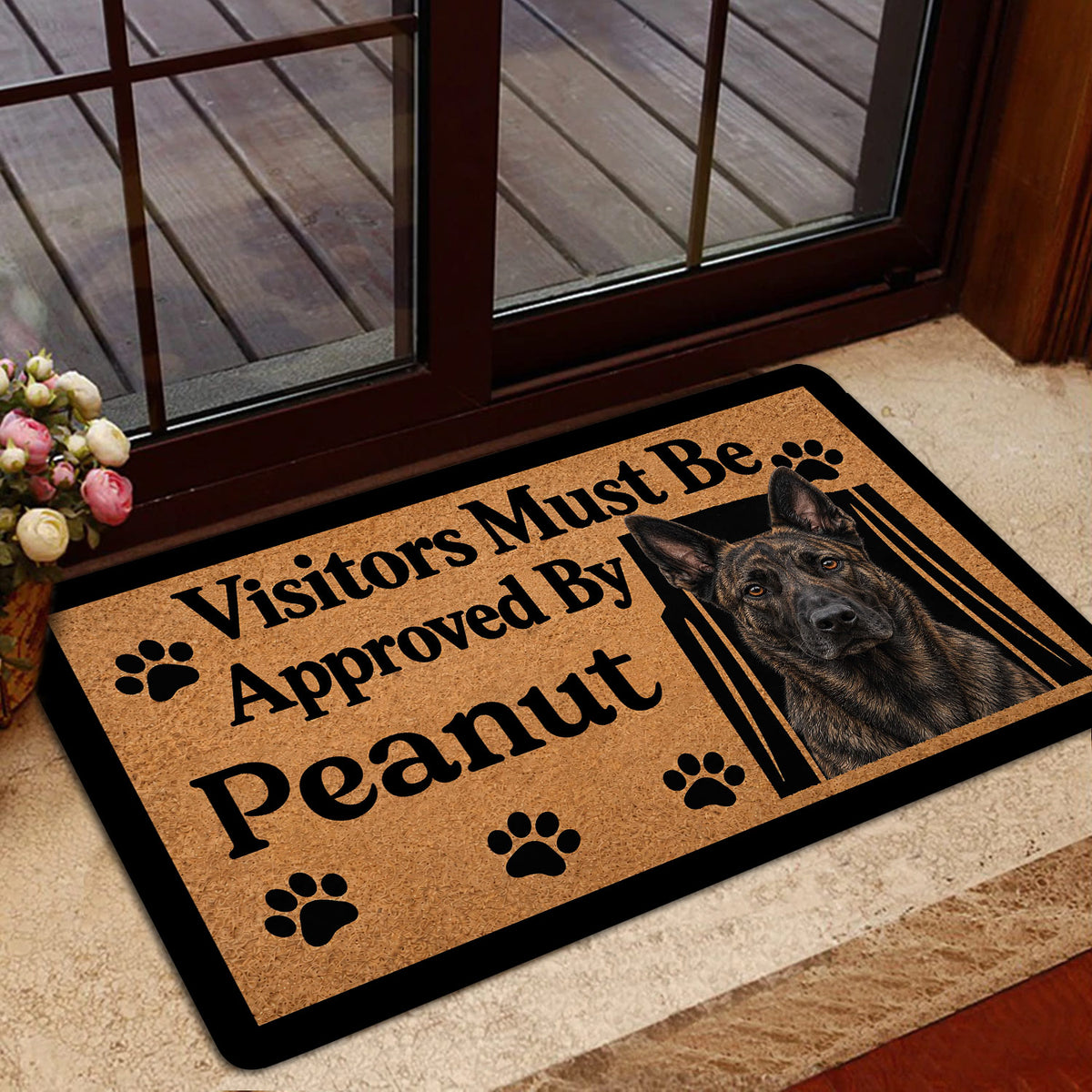 Dutch Shepherd door mat positioned by a glass entrance with tan artwork and black border