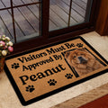 Chow Chow doormat displayed near a glass door in a home entryway with a dog portrait and paw print accents