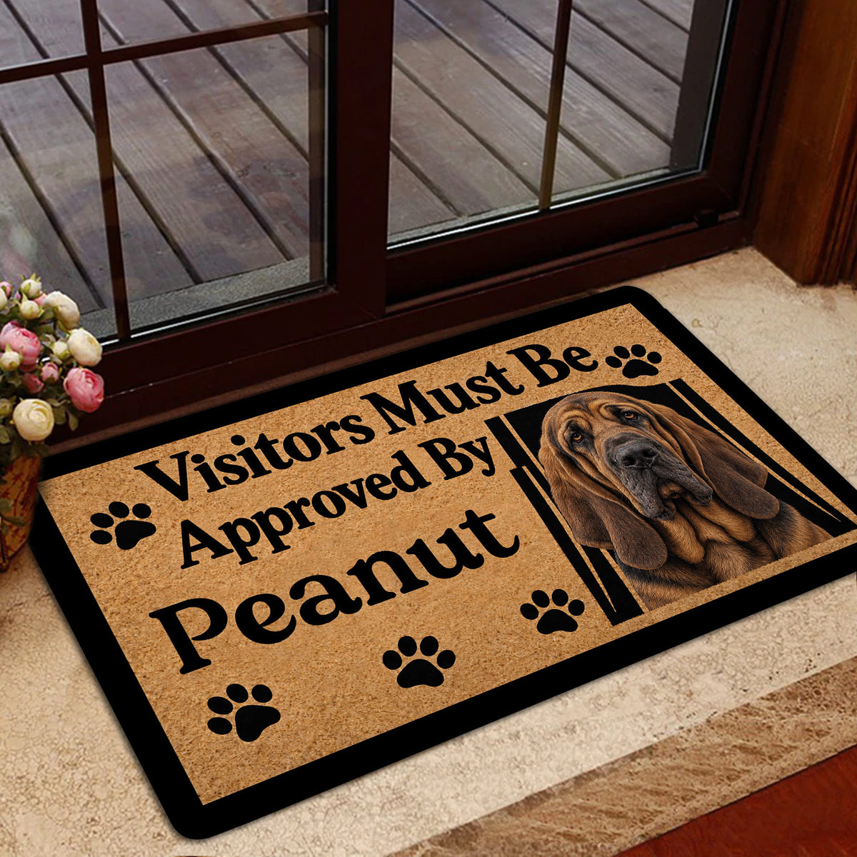 Bloodhound doormat styled at a home entrance with paw print accents and dog portrait