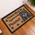 Schnoodle dog doormat styled in a home entryway on a warm wood floor