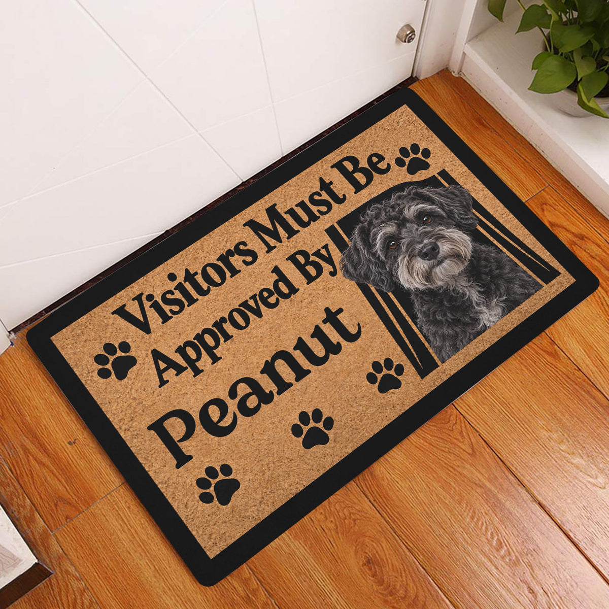Schnoodle dog doormat styled in a home entryway on a warm wood floor