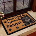 Schnoodle welcome doormat displayed near a glass door and indoor entryway